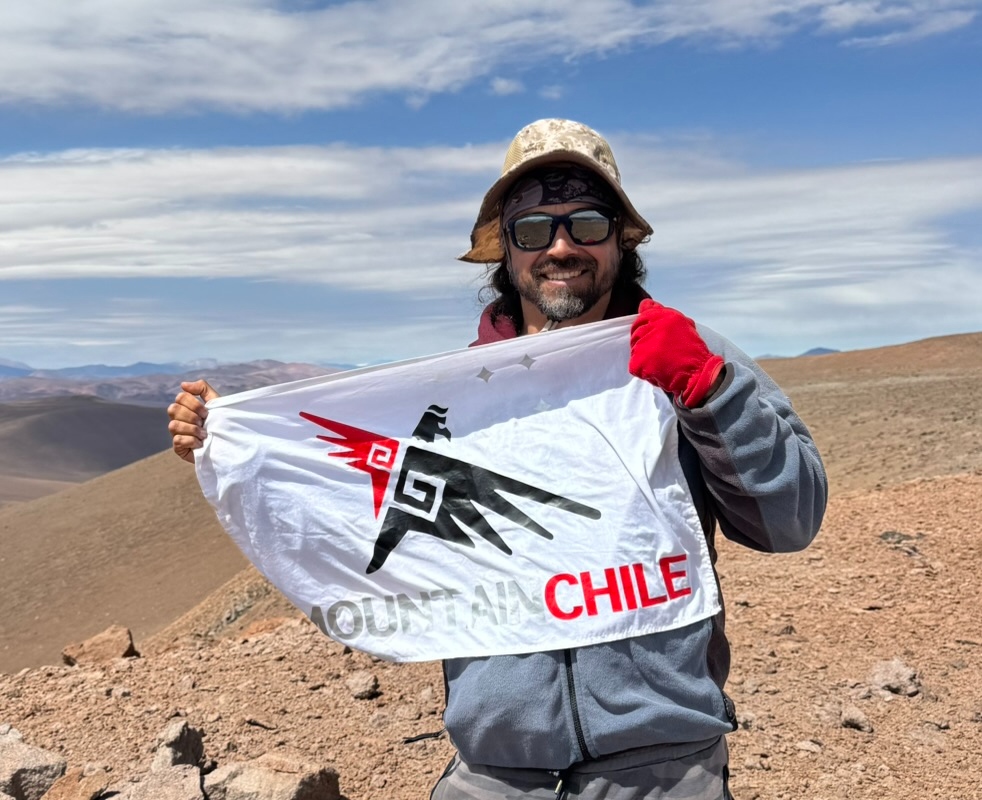 Fernando "Fena" Marcenaro, Operations Director and Lead Guide, on a high-altitude snowfield in the Chilean Andes