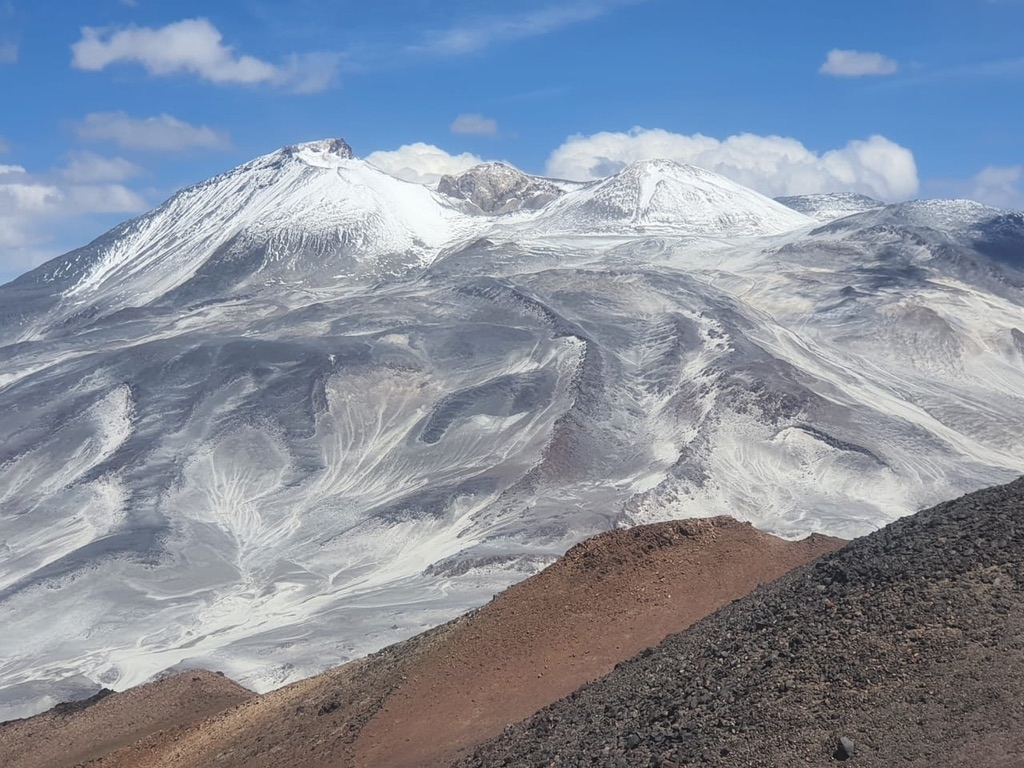 Ojos del Salado reflected in a high-altitude lake