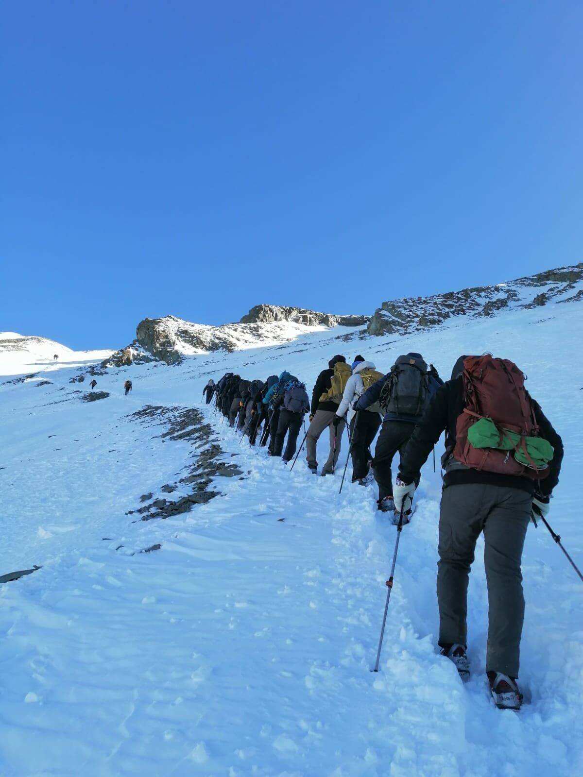Climbers on a snow line
