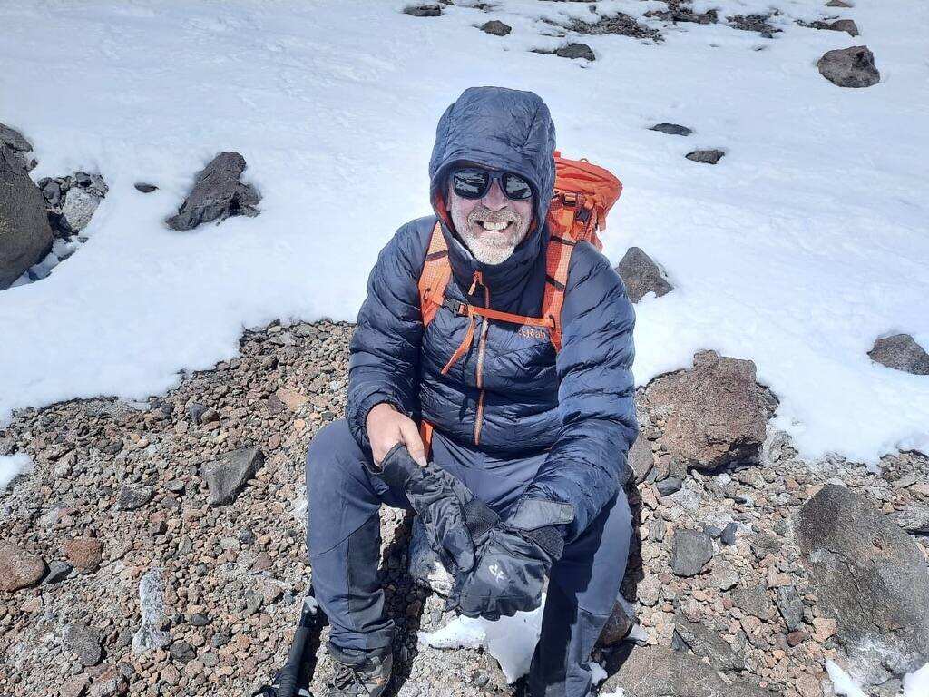 Steve Birchfield taking a rest break on a high-altitude rest stop